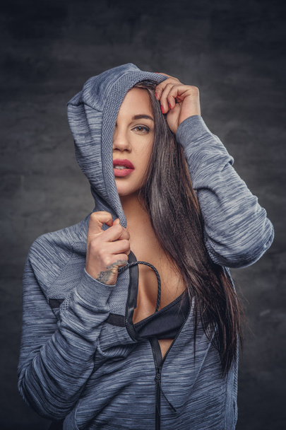 Sensual female in grey hoodie - Foto, Bild