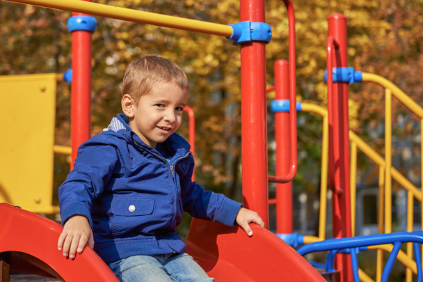 Portrait of a happy child on the playground - 写真・画像