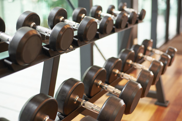 Metal dumbbells in gym - Foto, imagen