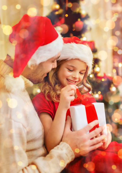 smiling father and daughter opening gift box - Foto, Imagem