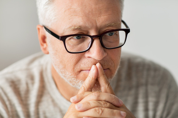 close up of senior man in glasses thinking - Fotoğraf, Görsel