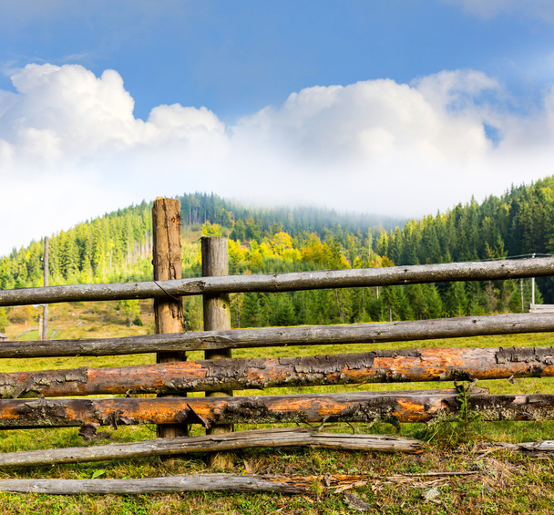 wooden fence on mountain meadow - Photo, Image