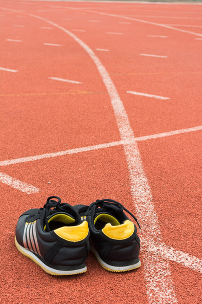 Sport shoes on running track background - Photo, Image