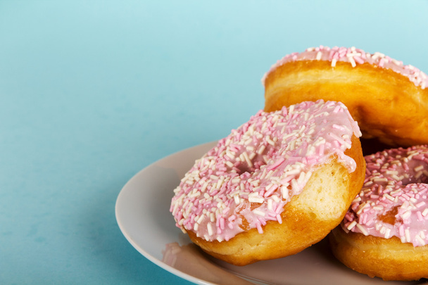 Iced doughnut on a light blue background - Photo, Image