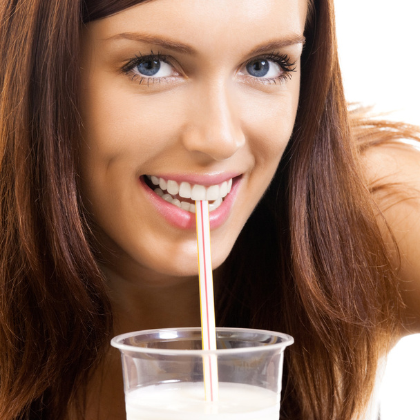 Beautiful woman drinking milk, over white - 写真・画像