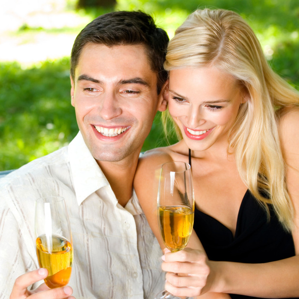 Young happy couple with champagne, outdoor - Valokuva, kuva