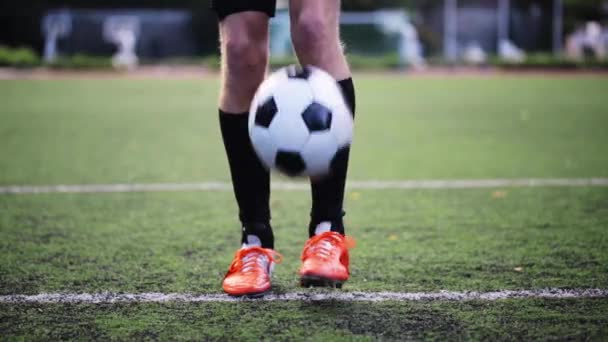 soccer player playing with ball on field - Video
