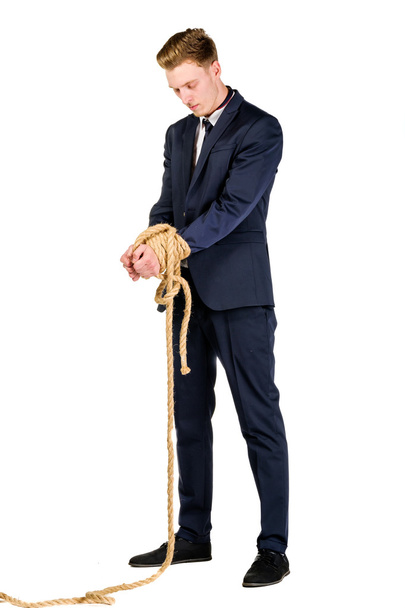 Young businessman in a suit tied up - Φωτογραφία, εικόνα
