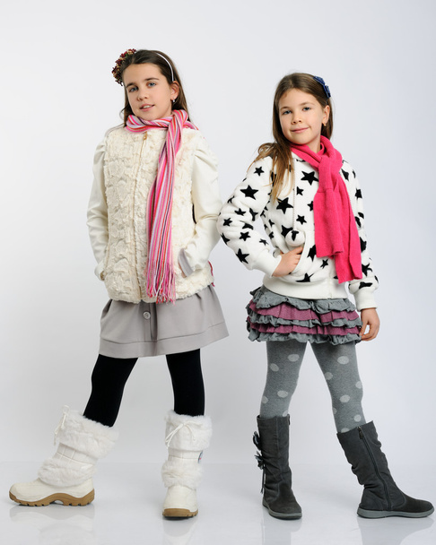 cheerful girls in a winter clothes - Фото, изображение