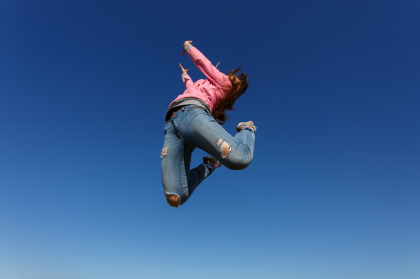 Young beautiful woman dancer jumping  - Fotó, kép