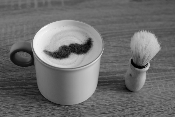 cup of cappuccino and old barber tool - Photo, Image