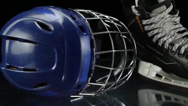 Close-up dolly shot on hockey skates and hockey helmet. - Footage, Video