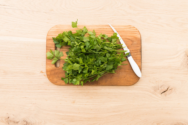 parsley on a board for cutting and cooking - Photo, Image
