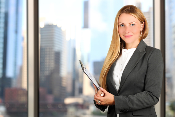 Portrait of business woman standing  near window - Foto, Imagen