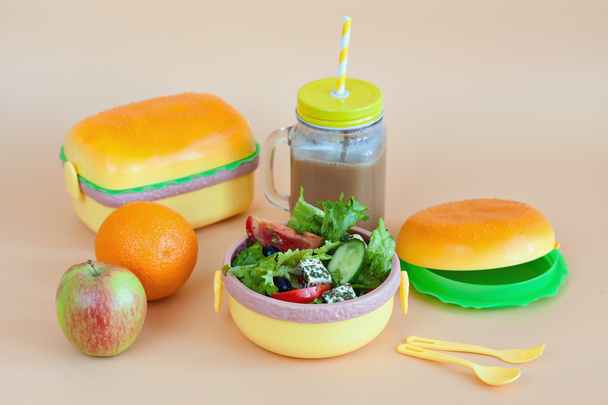 Lunch boxes for children in the form of hamburger. Fresh vegetables and fruits - Foto, Imagen