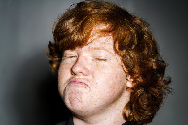 Emotive portrait of red-haired freckled boy, childhood concept - Fotografie, Obrázek