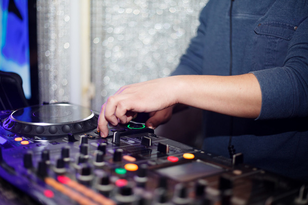 Dj mixes the track in the nightclub at party - Photo, image