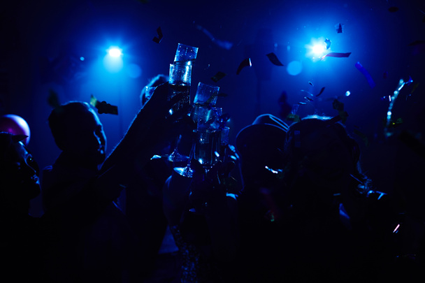 Crowd of toasting people enjoying night - Photo, Image
