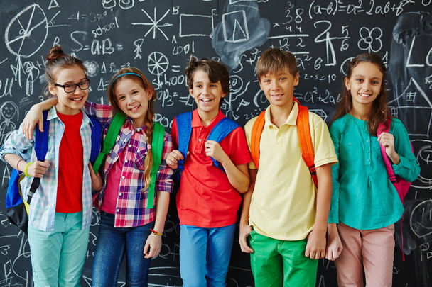 Happy Schoolkids at blackboard - Фото, зображення
