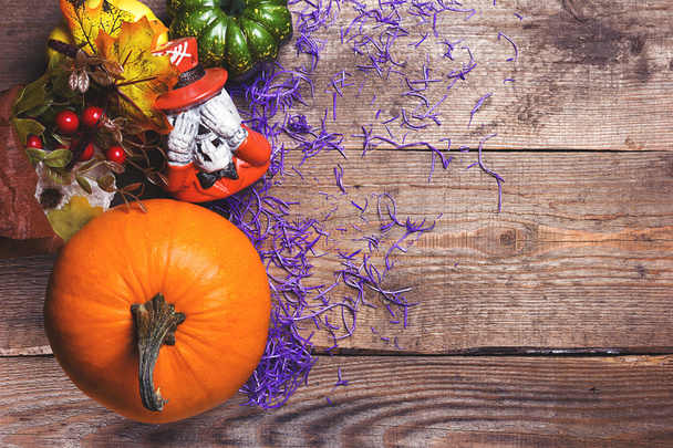 Happy Halloween postcard. Pumpkins and decor against an old wood background. Purple and vintage tinted - Fotó, kép