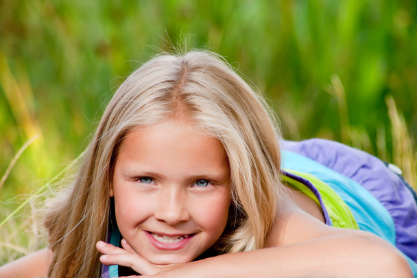 Smiling little blond girl - Φωτογραφία, εικόνα
