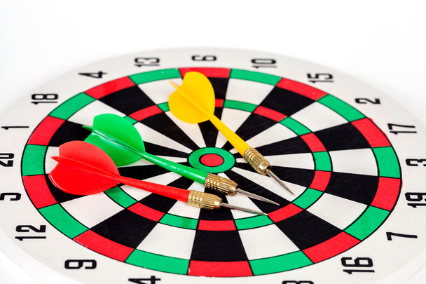 dart arrow on dart board , white background - Foto, Imagen