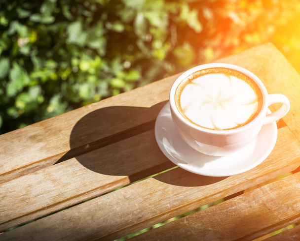 Coffee cup on wooden table ,soft focus - Foto, immagini