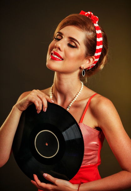 Dívka ve stylu drží vinyl záznam. - Fotografie, Obrázek
