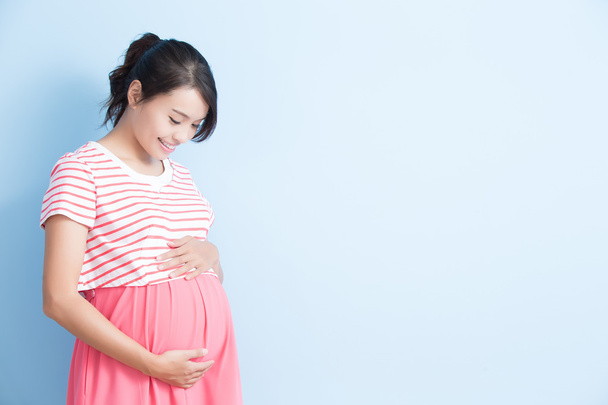 pregnant woman is smiling  - Valokuva, kuva