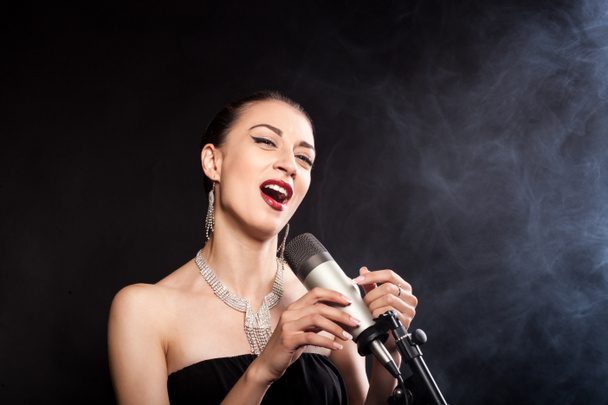 Singing Girl with a microphone - Photo, Image