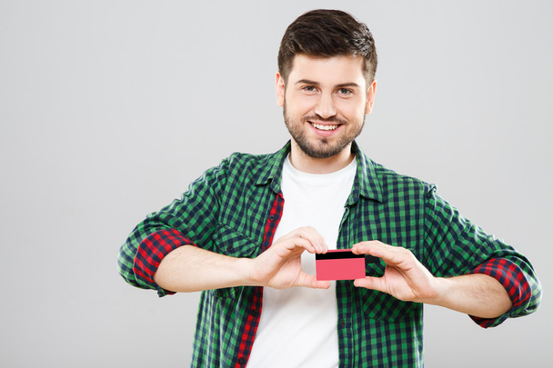 Boy holding red credit card - Fotografie, Obrázek