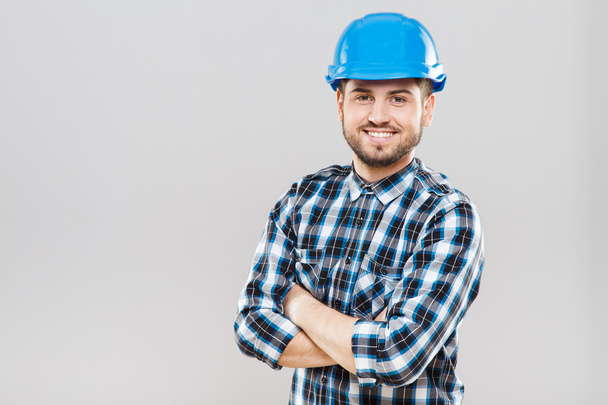 Man in blue building helmet  - Фото, изображение