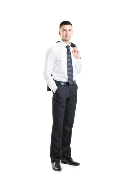 Young businessman with jacket behind his back - Photo, image