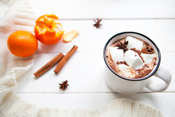 Hot chocolate with marshmallows in a ceramic cup, cinnamon stick - Zdjęcie, obraz