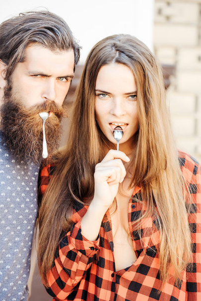 young couple with tea spoon - Fotoğraf, Görsel