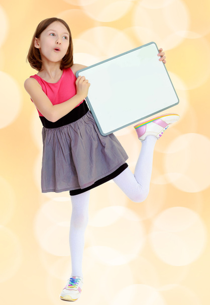 Little girl holding white poster. - Φωτογραφία, εικόνα