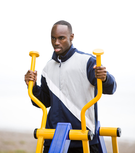young man working out at outdoor gym - Foto, Imagen