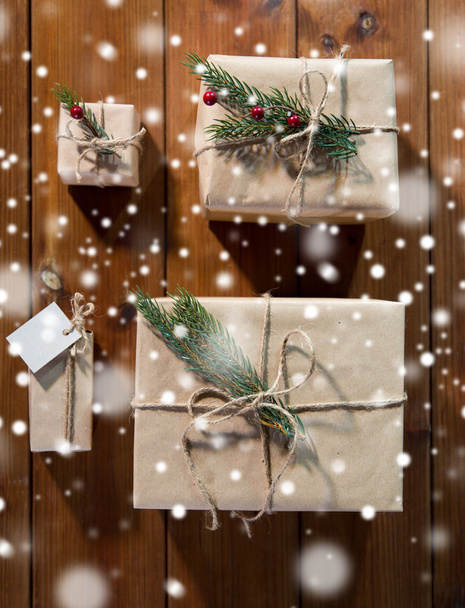 close up of christmas gifts with fir brunch - Foto, Imagem