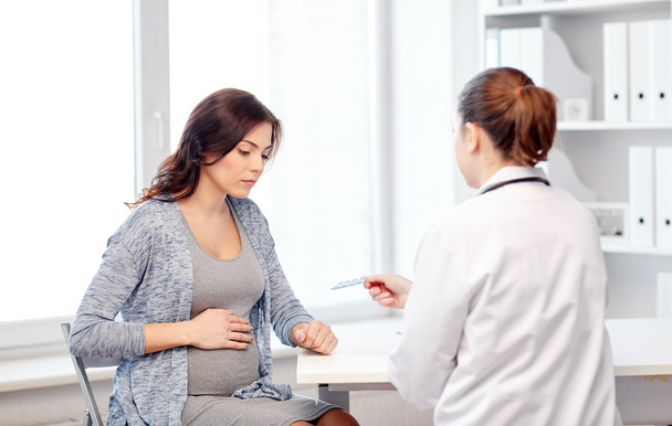 gynecologist doctor and pregnant woman at hospital - Fotó, kép