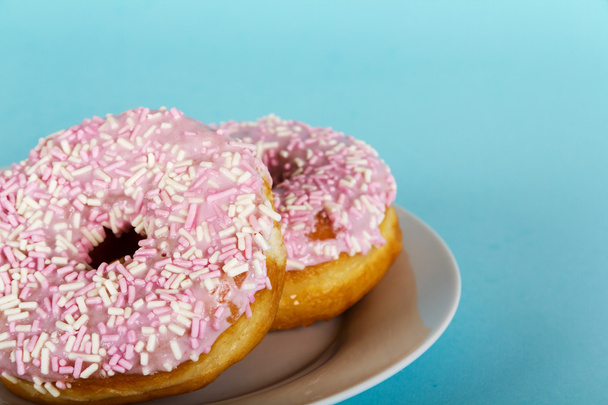 Iced doughnut on a light blue background - Photo, Image