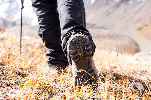 Hiking boots on rocks. - Photo, Image