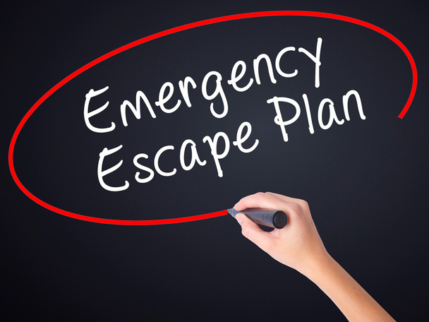 Woman Hand Writing Emergency Escape Plan with a marker over tran - Photo, Image