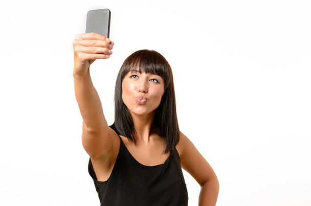 魅惑的な女性、selfie を取っている間をふくれっ面 - 写真・画像