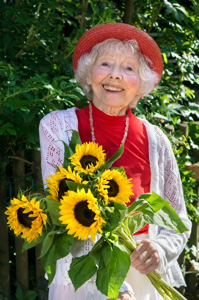 female gardener with sunflowers - Photo, image