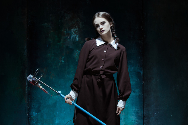 Portrait of a young girl in school uniform as a vampire woman - Fotografie, Obrázek
