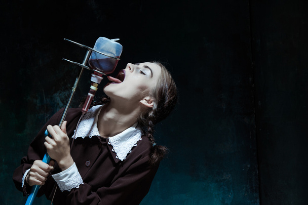 Portrait of a young girl in school uniform as a vampire woman - Photo, Image