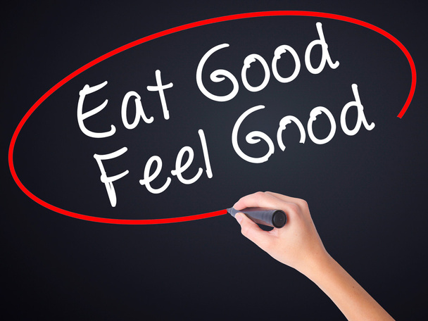 Woman Hand Writing Eat Good Feel Good with a marker over transpa - Foto, imagen