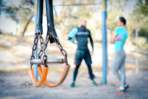 Couple working out with sport equipment on foreground  - Foto, Imagem