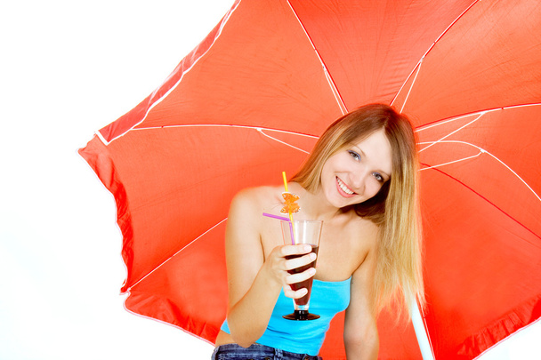 attractive girl with glass of juice under red umbrella over whit - Foto, Imagen