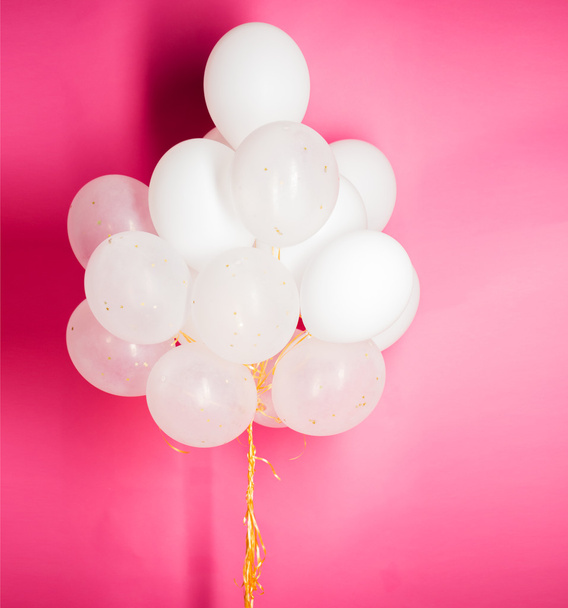 close up of white helium balloons over pink - Foto, Imagem